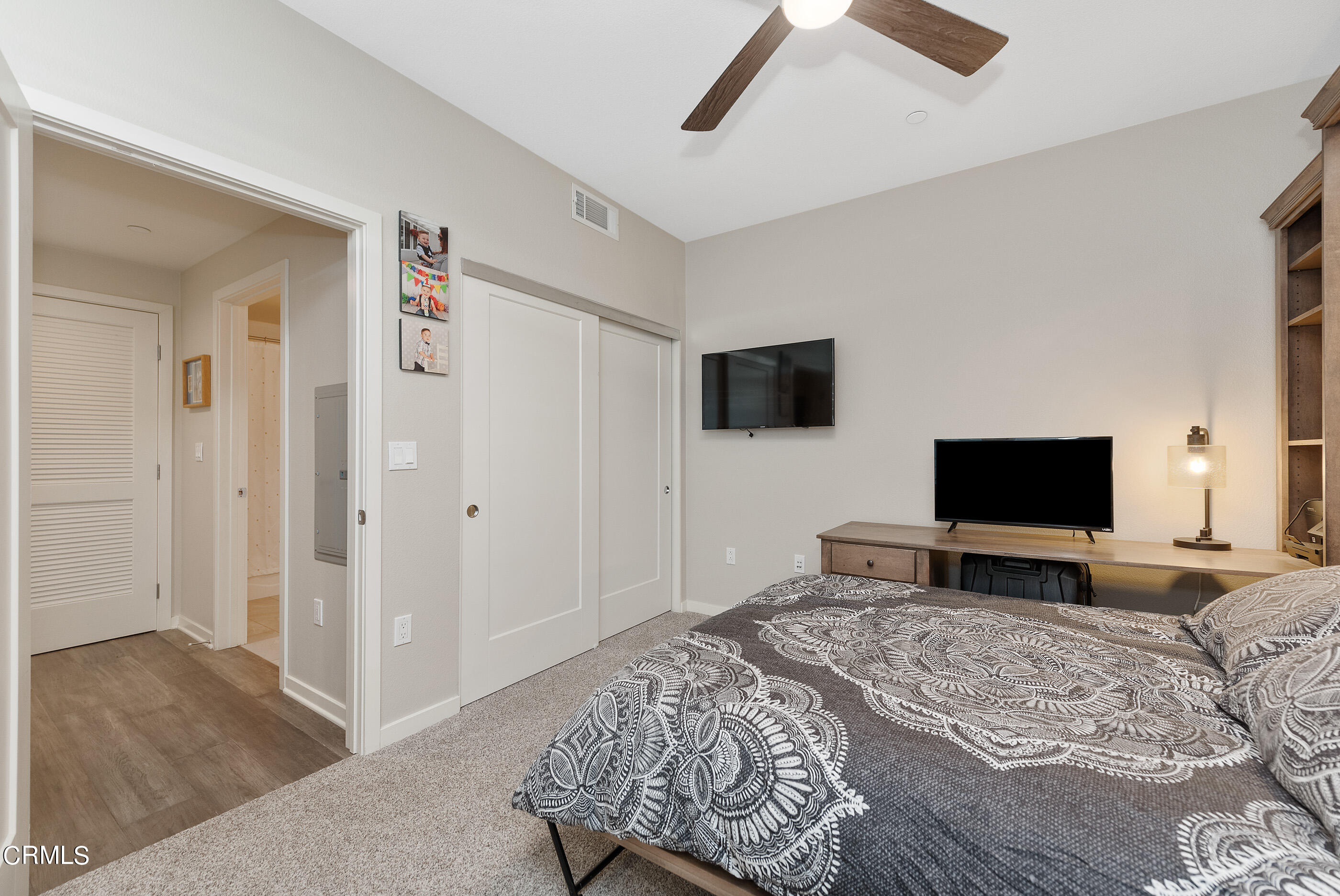 4048 Tradewinds Drive Oxnard, CA 93035 - Photo 26 of 53 a bedroom with a bed and a flat screen tv