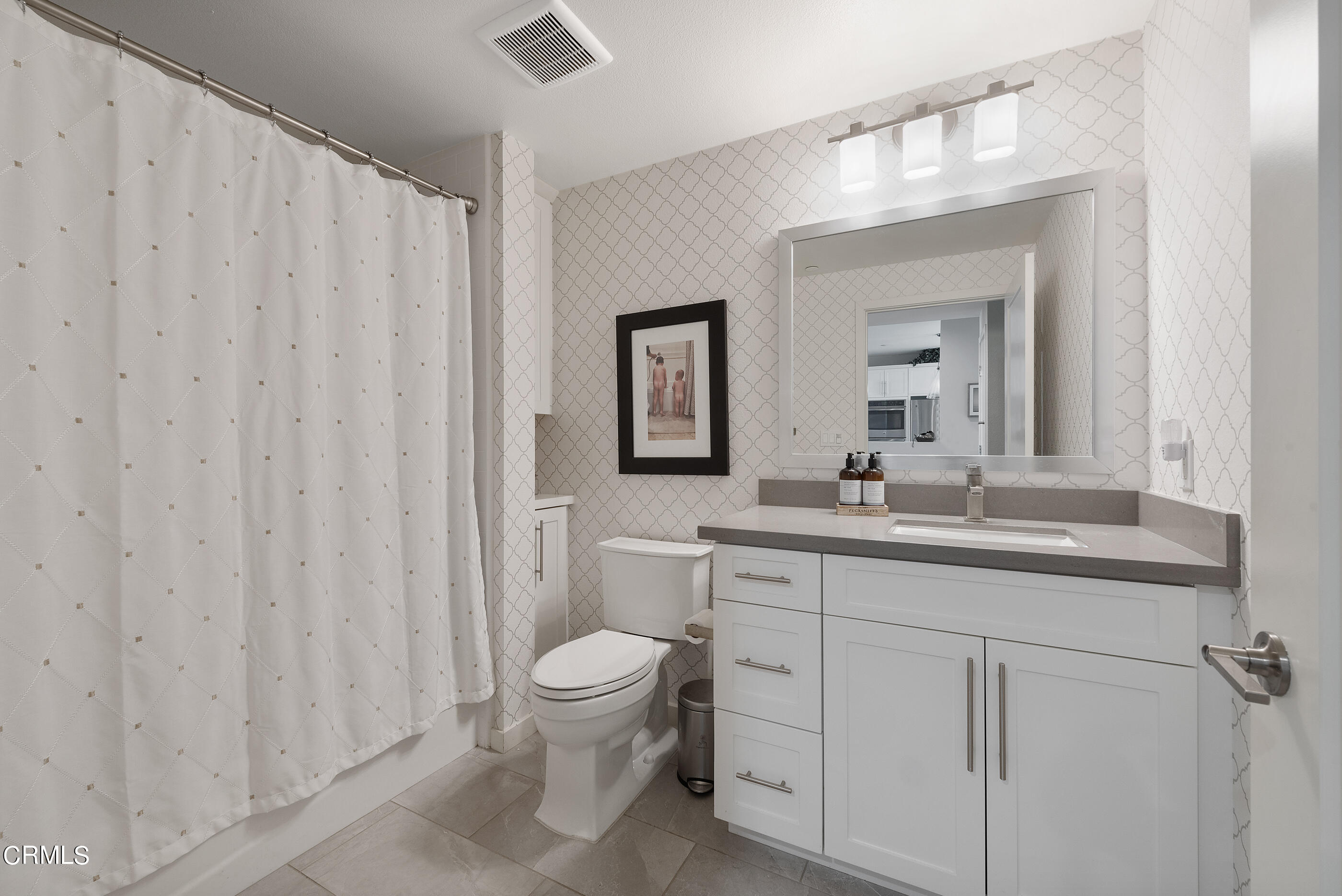 4048 Tradewinds Drive Oxnard, CA 93035 - Photo 27 of 53 a bathroom with a toilet a sink and a mirror