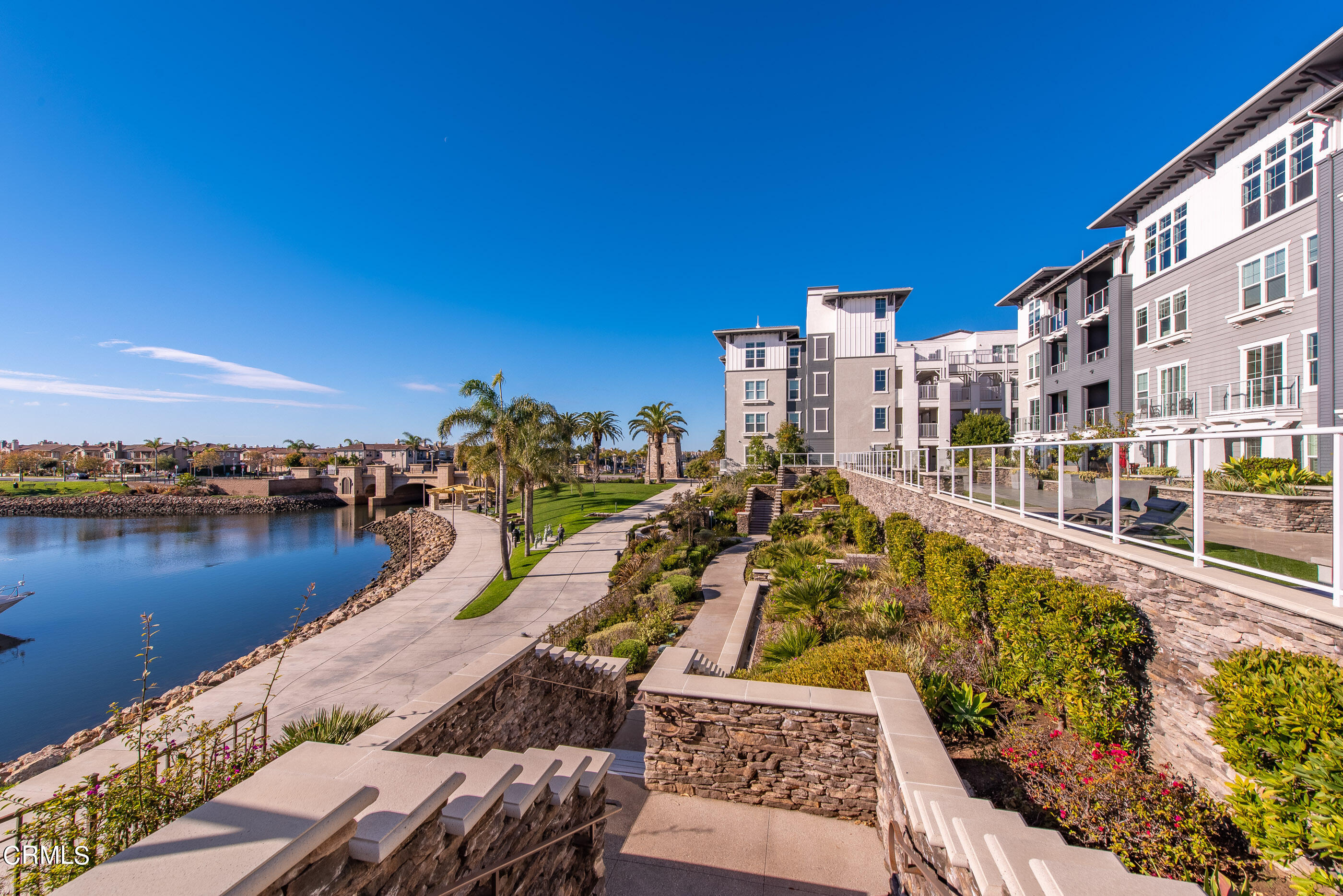4048 Tradewinds Drive Oxnard, CA 93035 - Photo 37 of 53 a view of a lake with a city skyline in the background