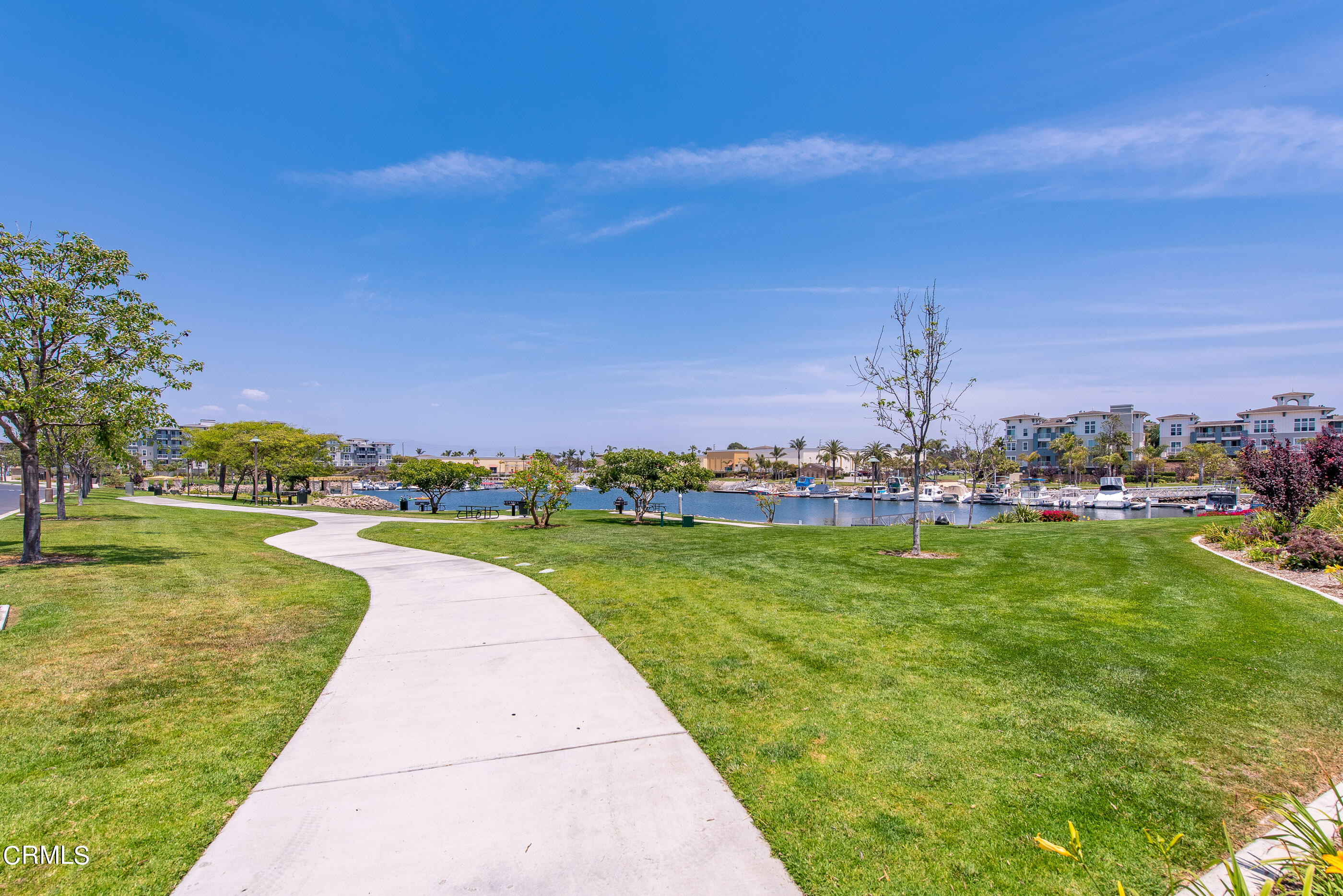 4048 Tradewinds Drive Oxnard, CA 93035 - Photo 48 of 53 a view of a lake with a garden