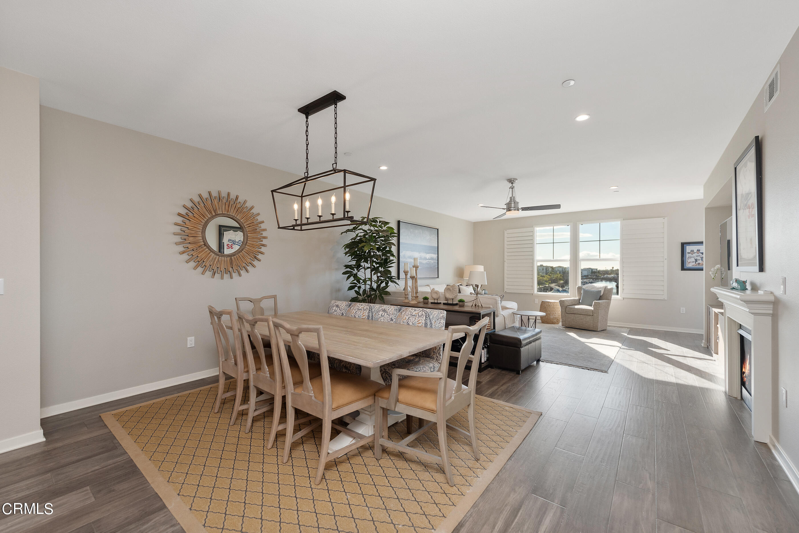 4048 Tradewinds Drive Oxnard, CA 93035 - Photo 7 of 53 a view of a dining room with furniture window and wooden floor