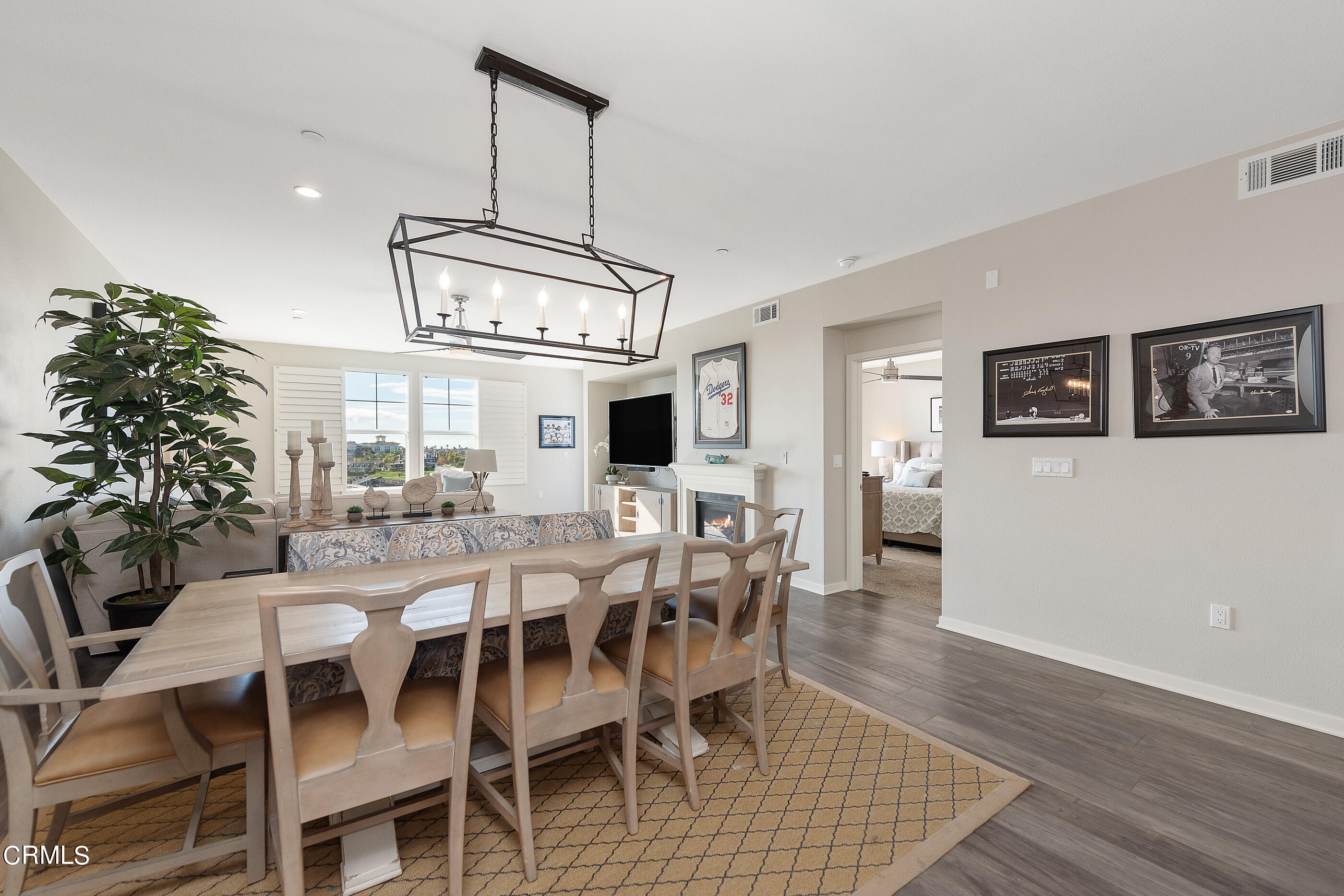 4048 Tradewinds Drive Oxnard, CA 93035 - Photo 8 of 53 a view of a dining room with furniture window and wooden floor