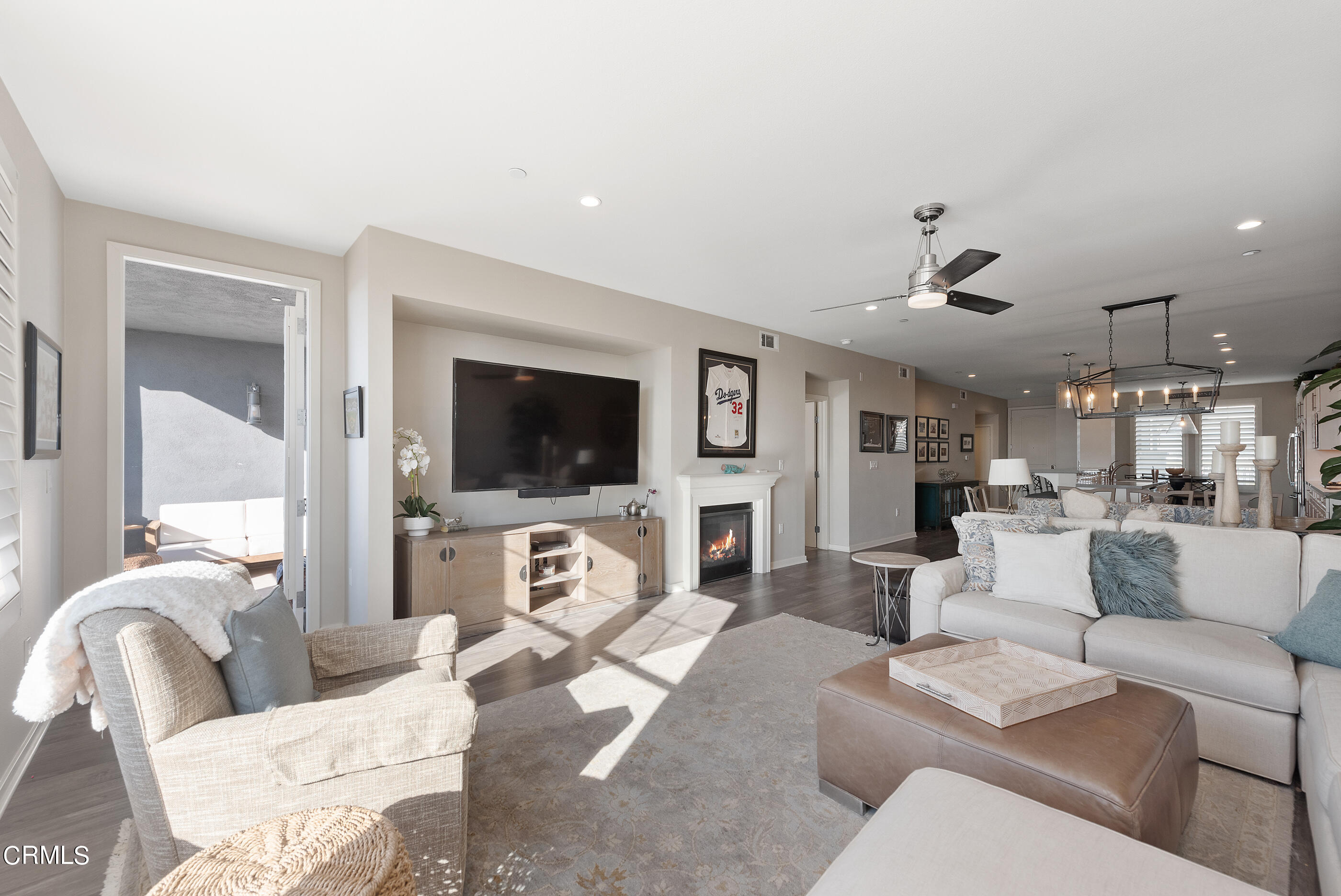 4048 Tradewinds Drive Oxnard, CA 93035 - Photo 10 of 53 a living room with furniture flat screen tv and a fireplace