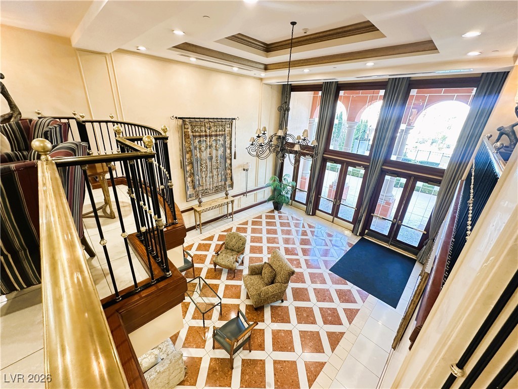 30 Strada Di Villaggio, Unit 627 Henderson, NV 89011 - Photo 4 of 12 Lobby featuring crown molding, recessed lighting, and stairway