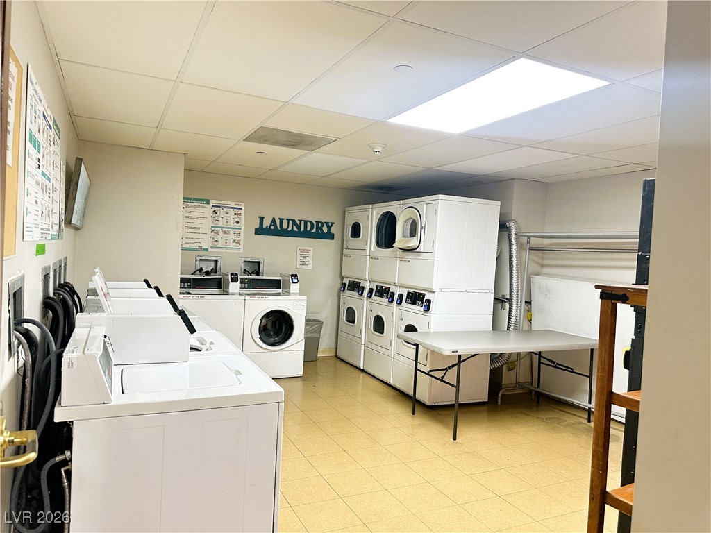 30 Strada Di Villaggio, Unit 627 Henderson, NV 89011 - Photo 9 of 12 Community laundry room with a drop ceiling, stacked washing machine and dryer, and separate washer and dryer