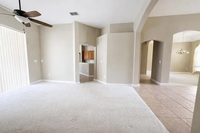 a view of an empty room with a bathroom