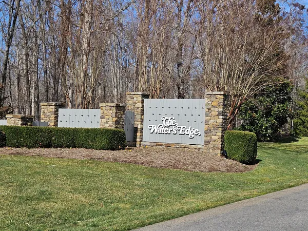 a view of a park with large trees