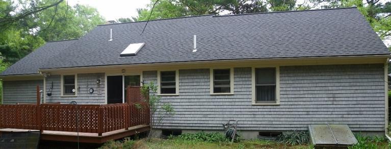 56 Shields Road Mashpee, MA 02649 - Photo 3 of 17 a view of a house with a door and wooden bench