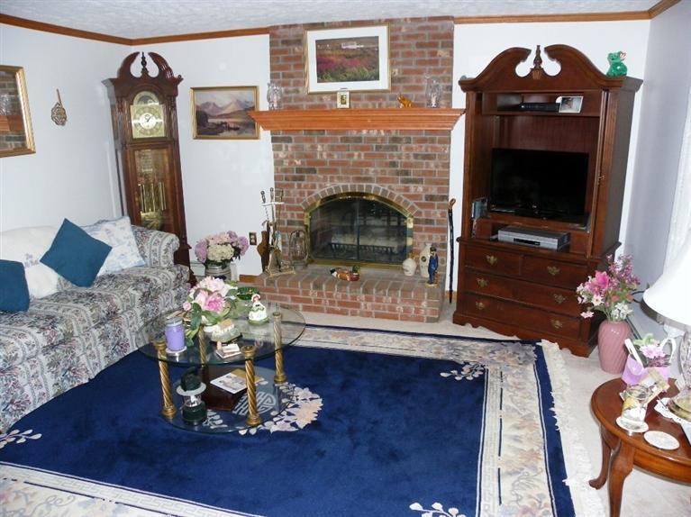 56 Shields Road Mashpee, MA 02649 - Photo 5 of 17 a living room with furniture and a fireplace