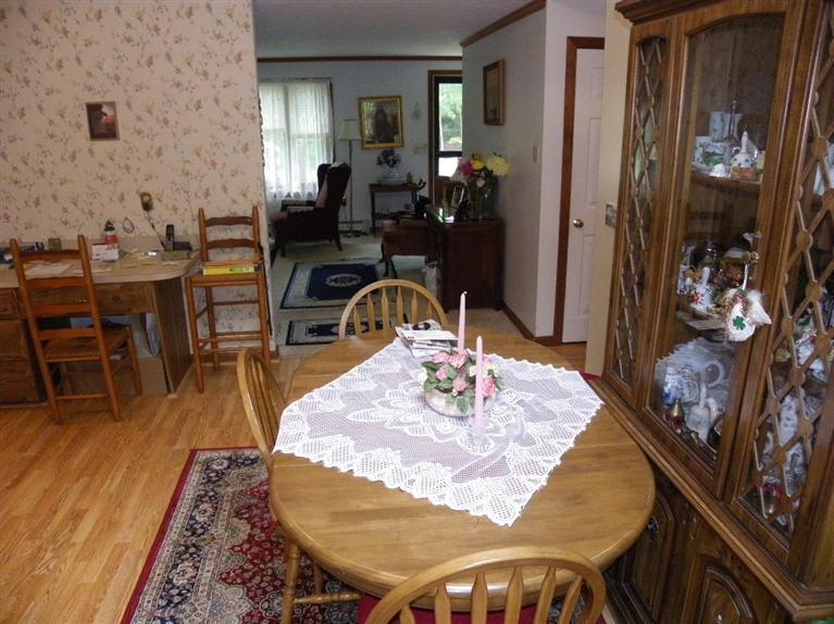 56 Shields Road Mashpee, MA 02649 - Photo 10 of 17 a view of a dining room with furniture and wooden floor
