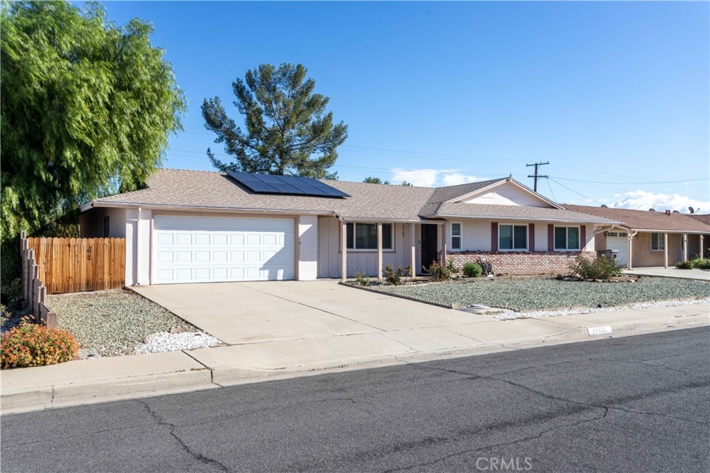 29300 Carmel Road Menifee, CA 92586 - Photo 1 of 1 a front view of a house with a yard and garage