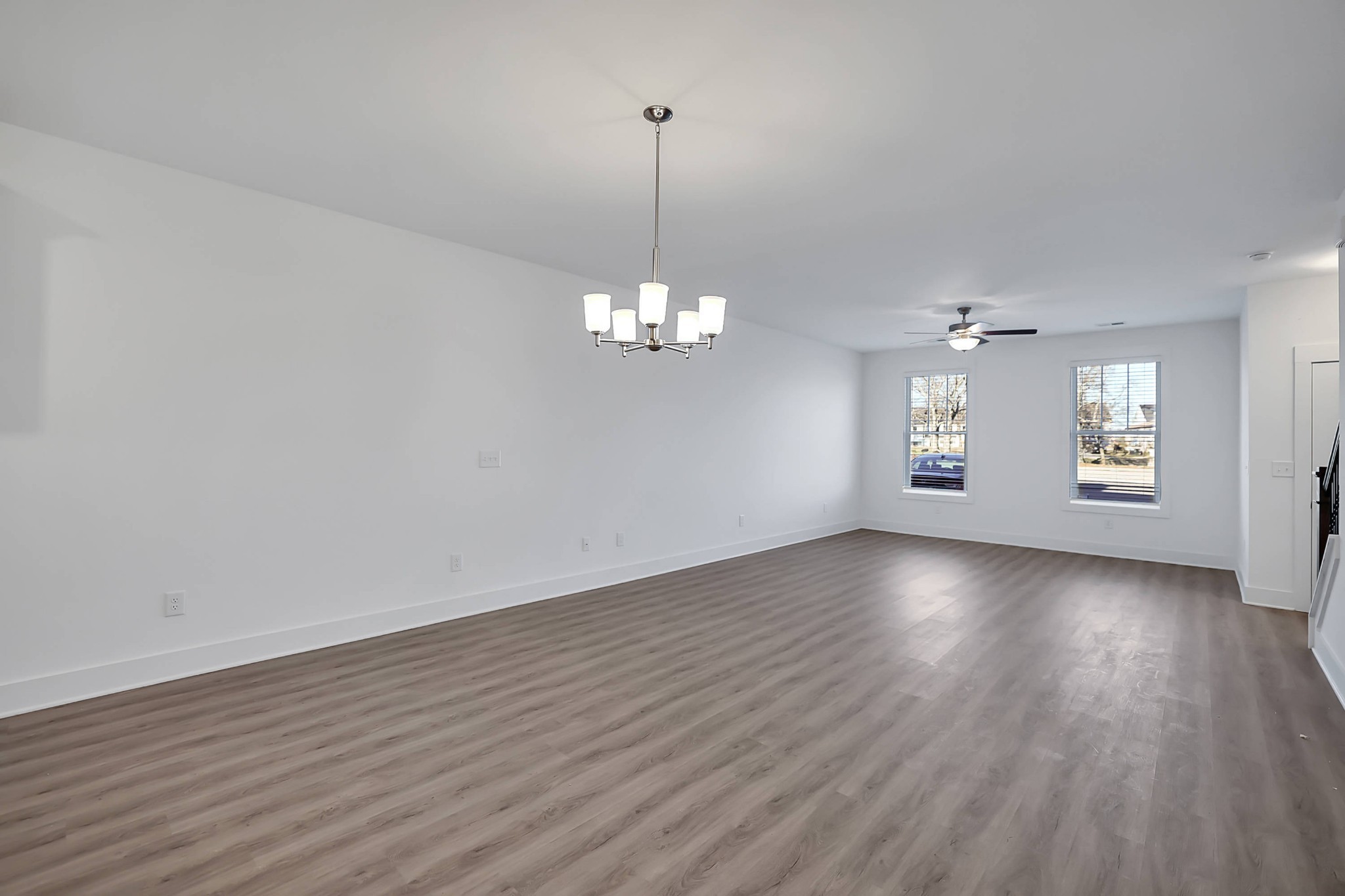 106 Floyd Junction Lebanon, TN 37087 - Photo 14 of 24 an empty room with wooden floor chandelier and windows