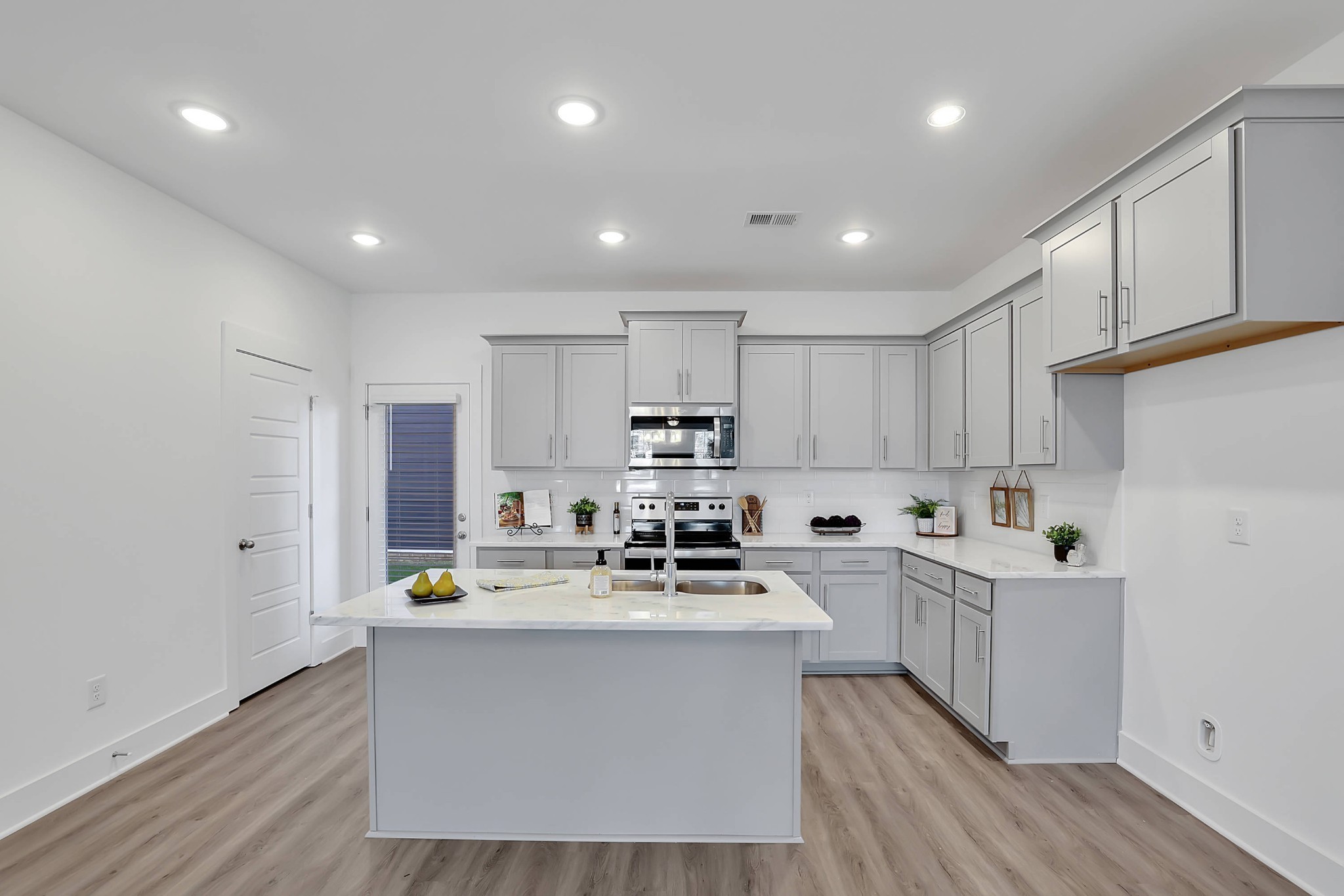106 Floyd Junction Lebanon, TN 37087 - Photo 8 of 24 a kitchen with counter top space cabinets and stainless steel appliances