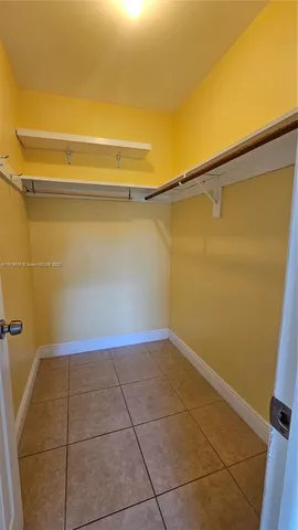 a view of a room with an empty space and the window