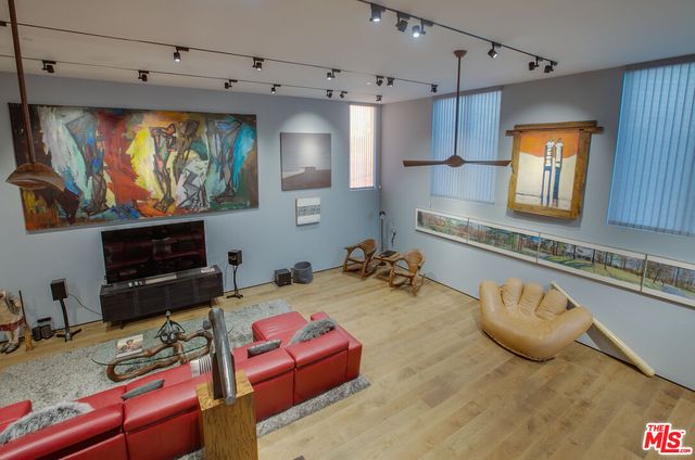 a kitchen with sink refrigerator and cabinets