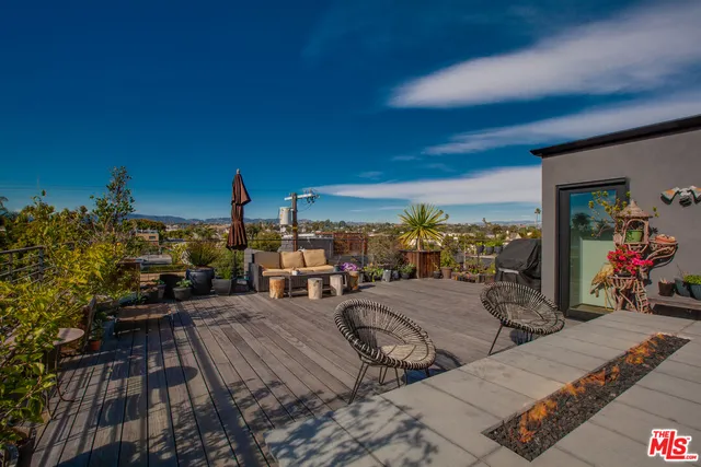 a view of a chairs and table in patio