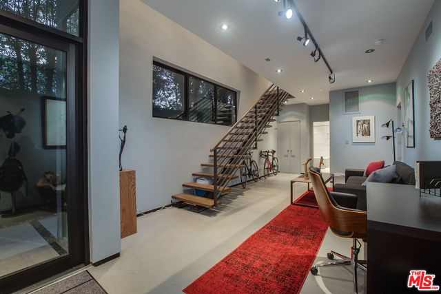 a view of a living room and entryway