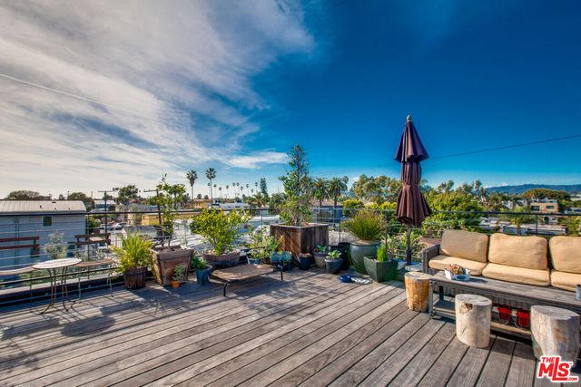 a view of a terrace with seating area