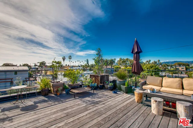 a view of a terrace with seating area