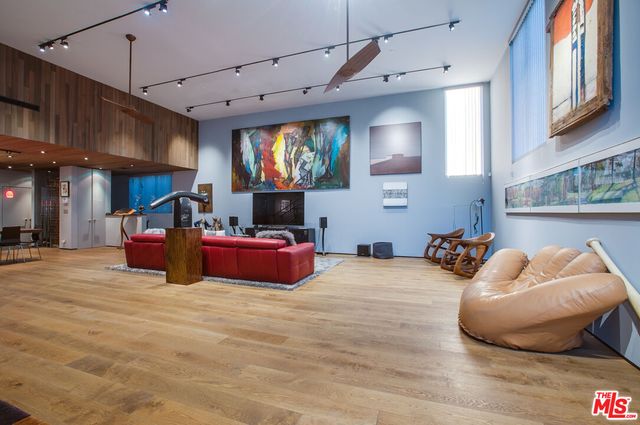 a room with furniture and a flat screen tv