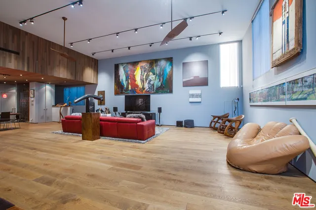 a room with furniture and a flat screen tv