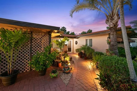 a view of a porch with potted plants