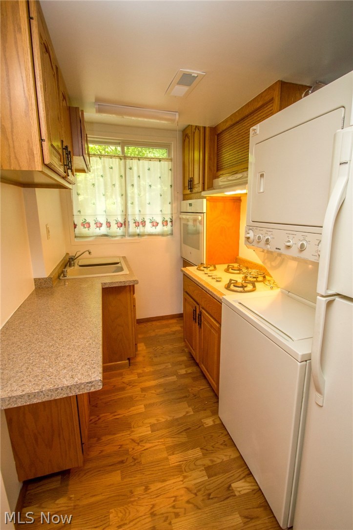 8107 Stone Road Independence, OH 44131 - Photo 16 of 29 1st floor laundry with kitchenette