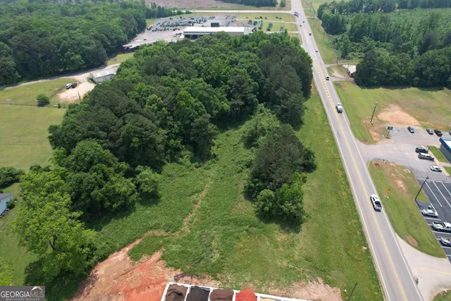 an aerial view of a house with yard
