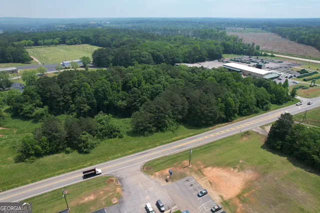 a view of a pool with a yard