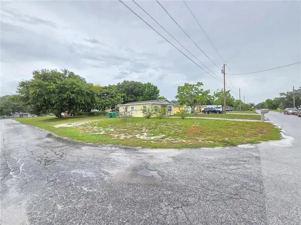 a view of a water fountain and a big yard