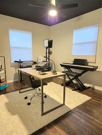 a room with gym equipment and a flat screen tv