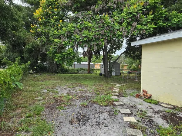 a backyard of a house with lots of green space