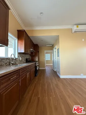 a spacious bathroom with a sink and a mirror