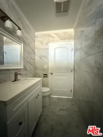 a bathroom with a sink and mirror