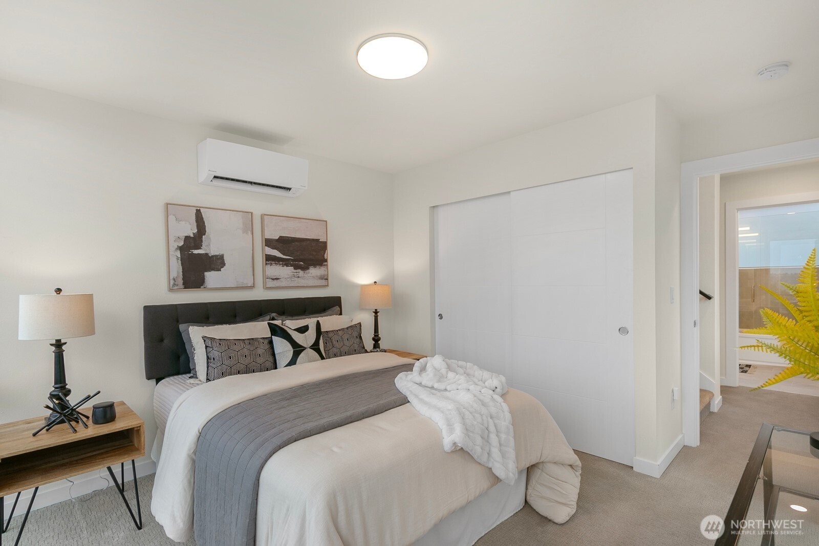 2408 13th Avenue South Seattle, WA 98144 - Photo 14 of 32 a bedroom with a bed and painting on the wall