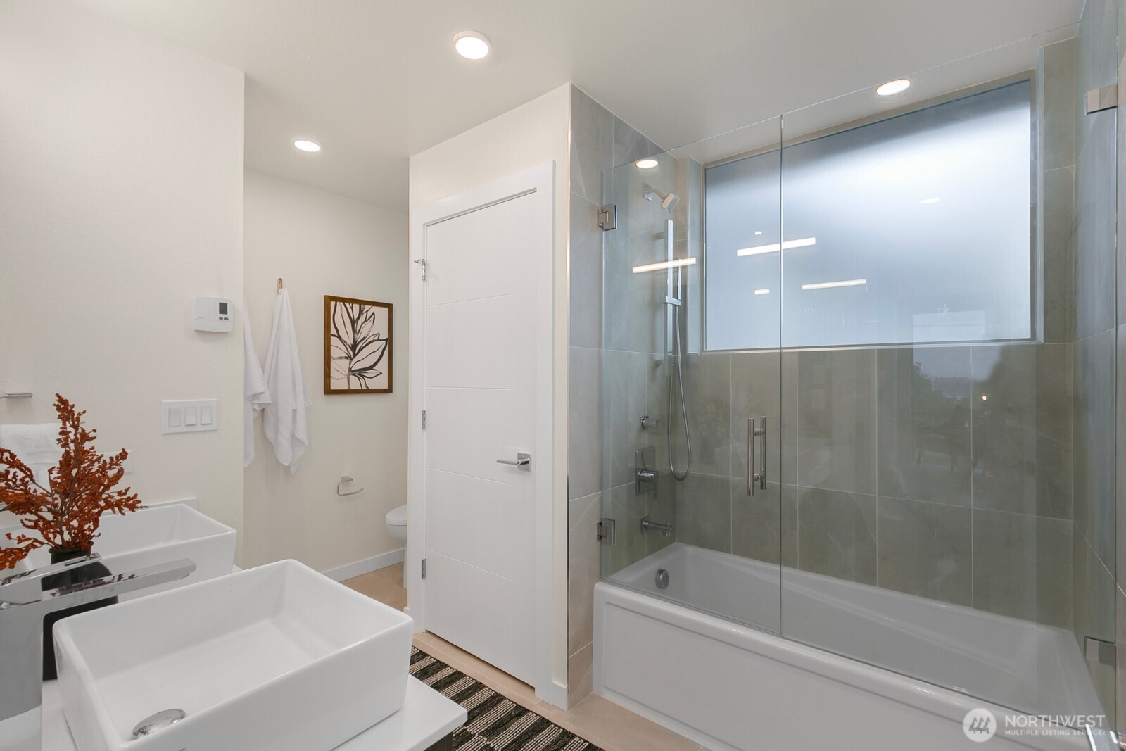 2408 13th Avenue South Seattle, WA 98144 - Photo 16 of 32 a bathroom with a bathtub a sink and a shower