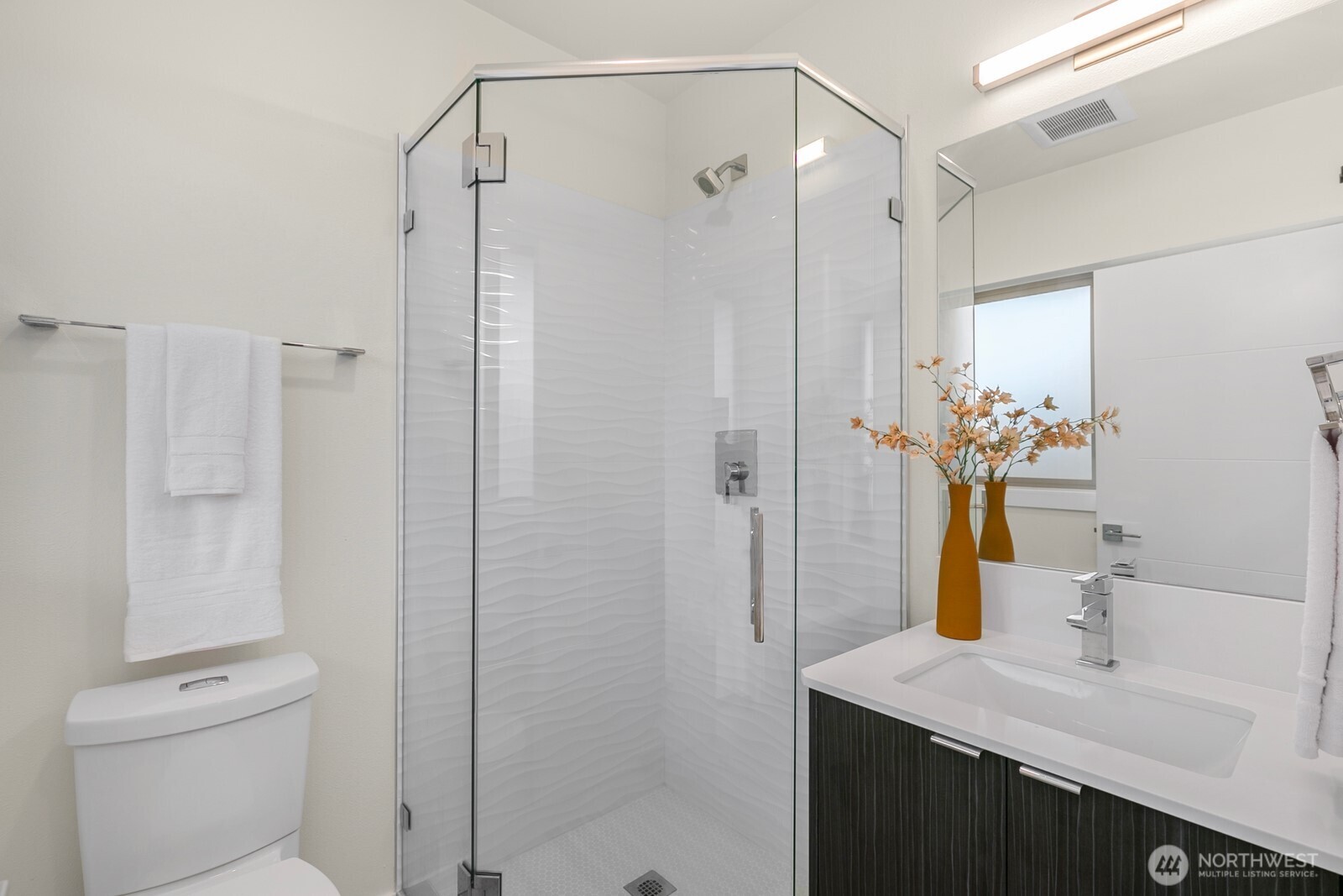 2408 13th Avenue South Seattle, WA 98144 - Photo 18 of 32 a bathroom with a shower sink vanity mirror and toilet