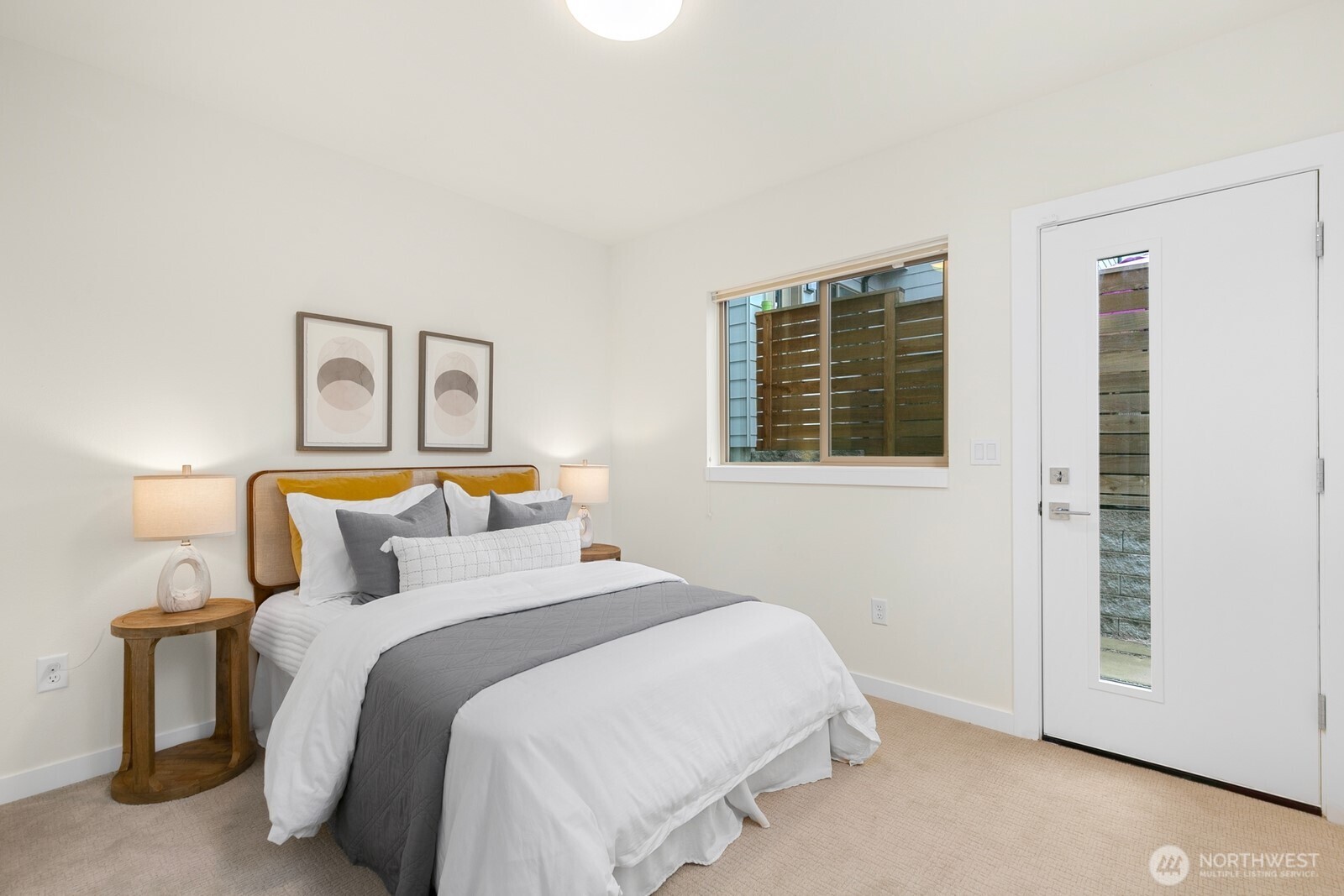2408 13th Avenue South Seattle, WA 98144 - Photo 19 of 32 a bedroom with a bed and a window
