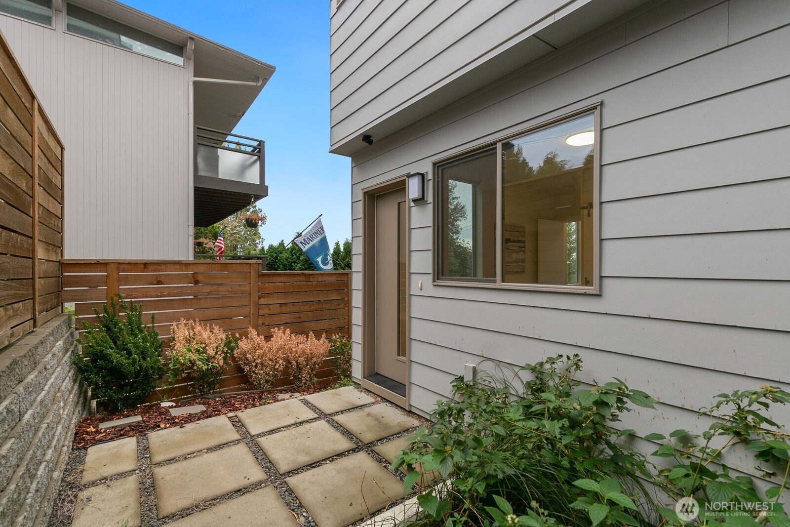 2408 13th Avenue South Seattle, WA 98144 - Photo 26 of 32 a view of a house with a flower garden