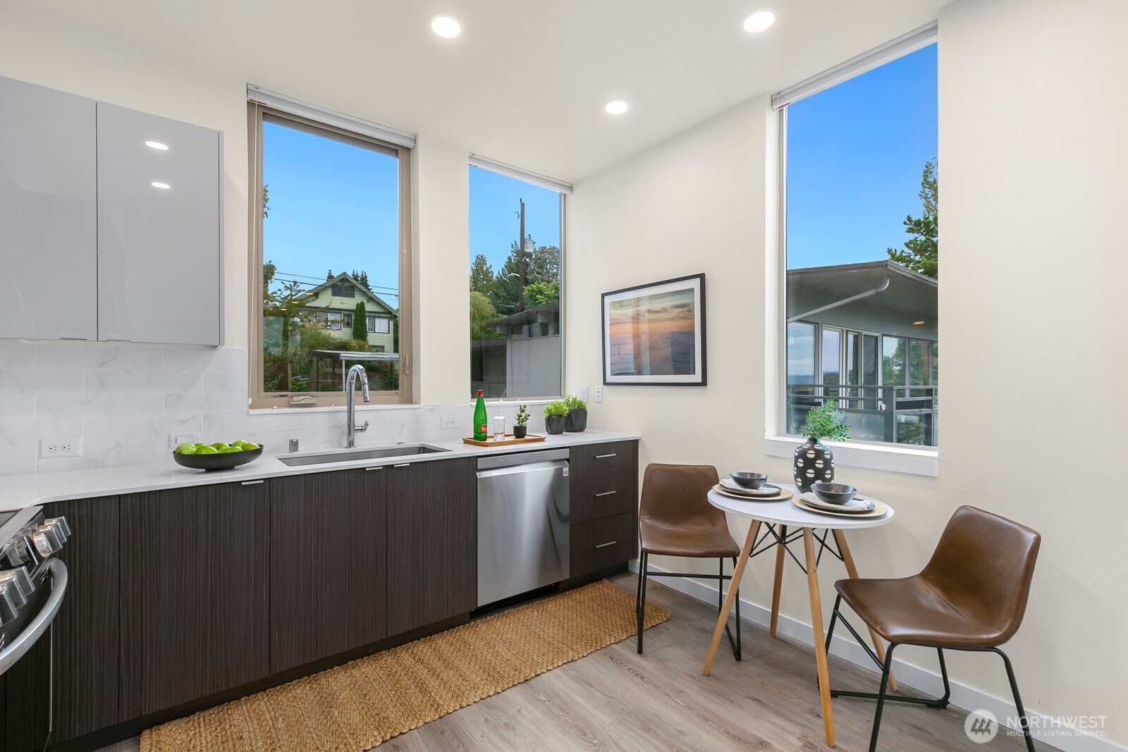 2408 13th Avenue South Seattle, WA 98144 - Photo 10 of 32 a kitchen with stainless steel appliances granite countertop a sink and cabinets