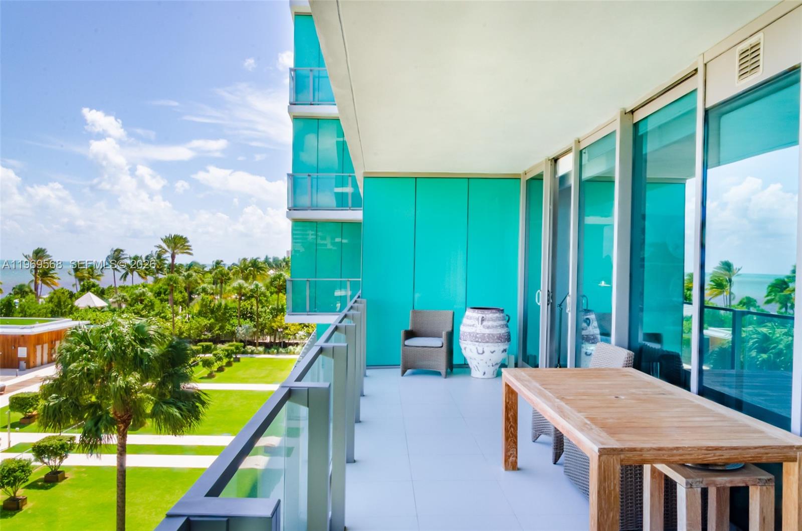 350 Ocean Drive, Unit 406N Key Biscayne, FL 33149 - Photo 23 of 41 a view of an outside dining space with furniture