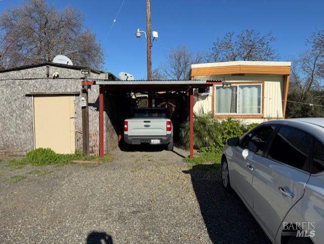 9415 Stevenson Bridge Road Winters, CA 95694 - Photo 15 of 15 a car parked in front of a house