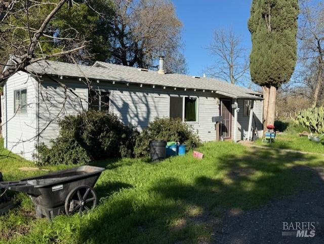9415 Stevenson Bridge Road Winters, CA 95694 - Photo 9 of 15 a view of a chair and table in backyard of the house