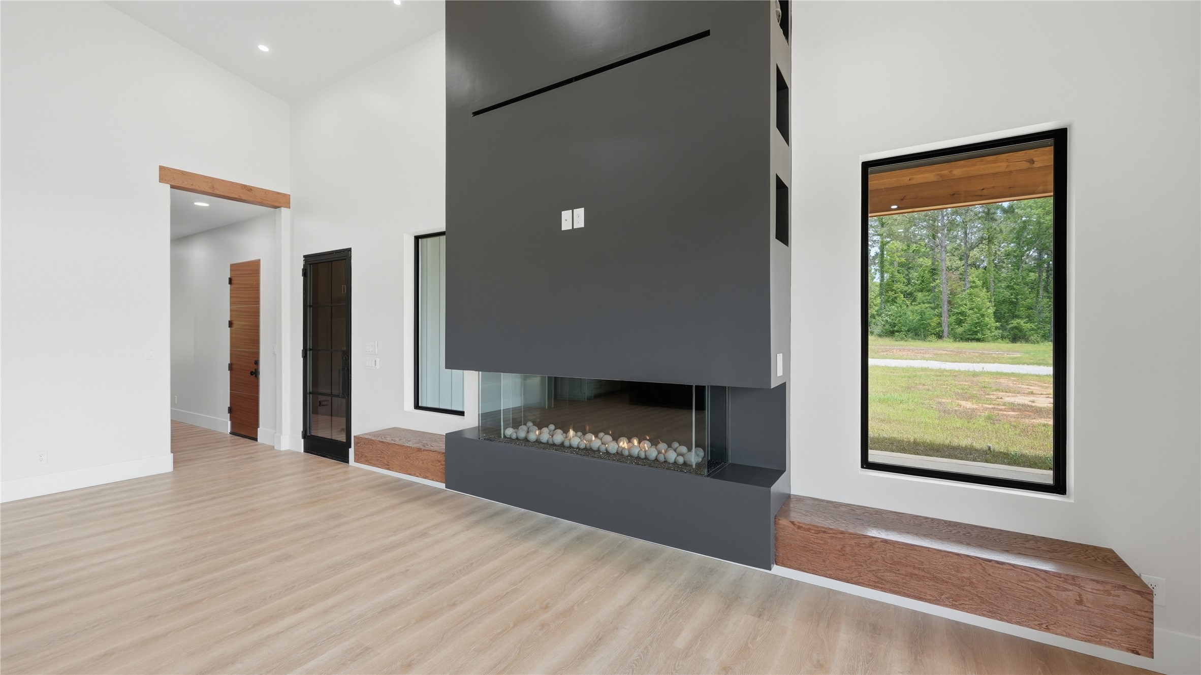 447 County Road 2211 Rusk, TX 75785 - Photo 29 of 50 a view of a livingroom with an empty space and a fireplace