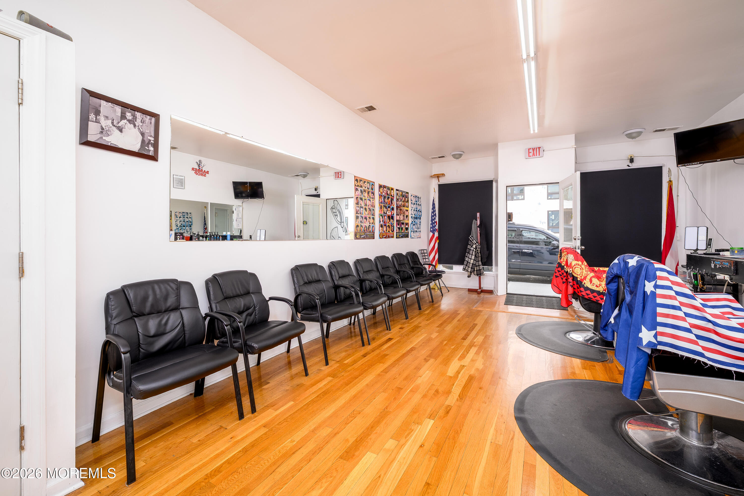 2nd Avenue, Unit 2 Long Branch, NJ 07740 - Photo 21 of 32 a living room with furniture a flat screen tv and kitchen view