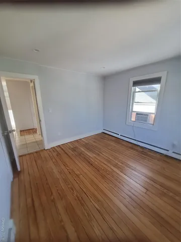 a bathroom with a double vanity sink mirror and toilet
