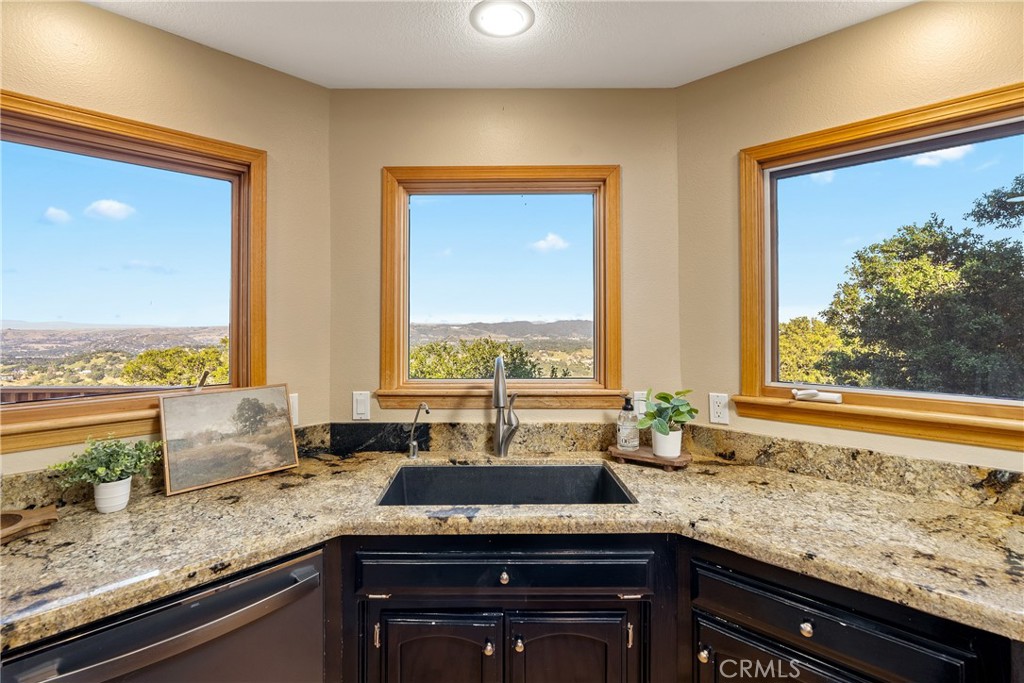 10885 San Marcos Road Atascadero, CA 93422 - Photo 11 of 35 a view of kitchen with granite countertop sink and cabinets