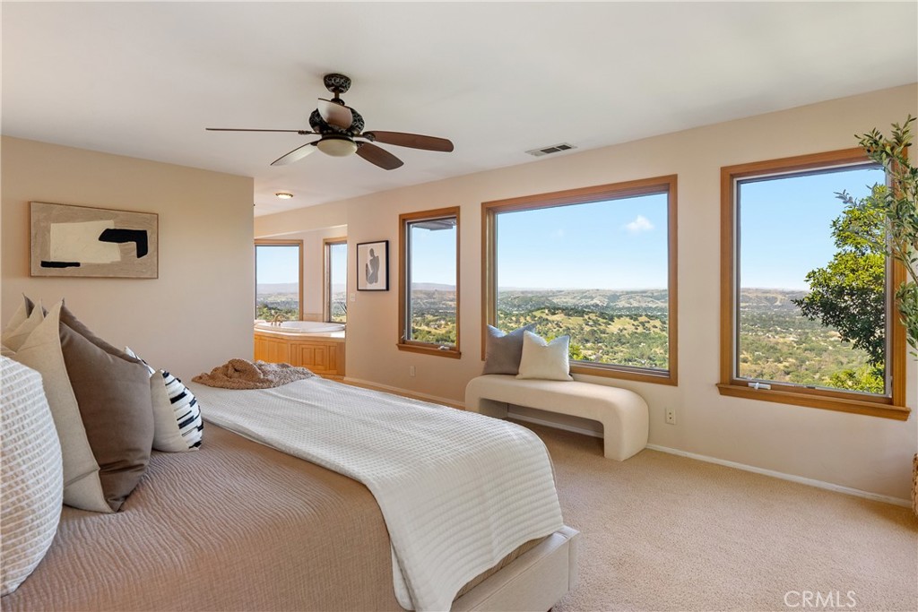 10885 San Marcos Road Atascadero, CA 93422 - Photo 17 of 35 a bedroom with a bed and a large window