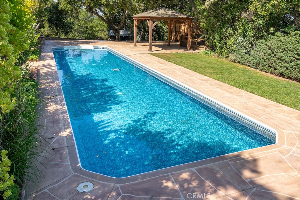 10885 San Marcos Road Atascadero, CA 93422 - Photo 29 of 35 a view of a swimming pool with a yard