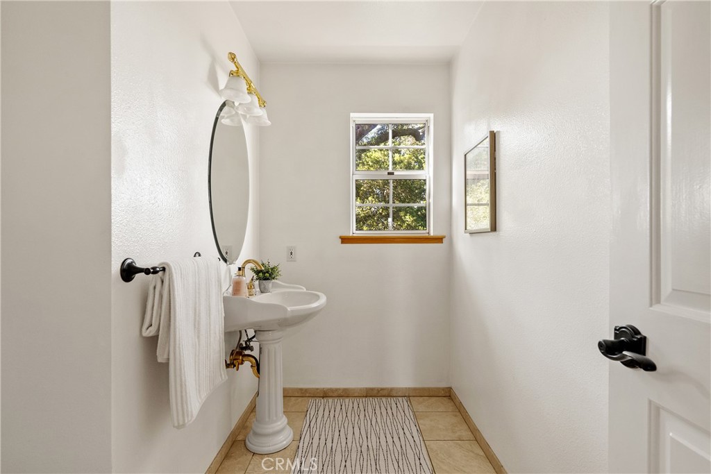 10885 San Marcos Road Atascadero, CA 93422 - Photo 8 of 35 a bathroom with a sink and a mirror